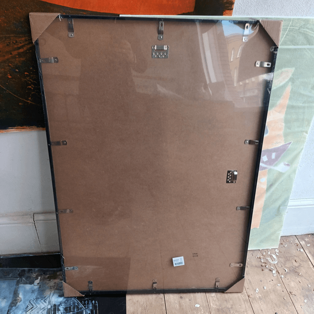 Wooden black painted frame with quality acrylic glass 70cmx100cm incl mount board.