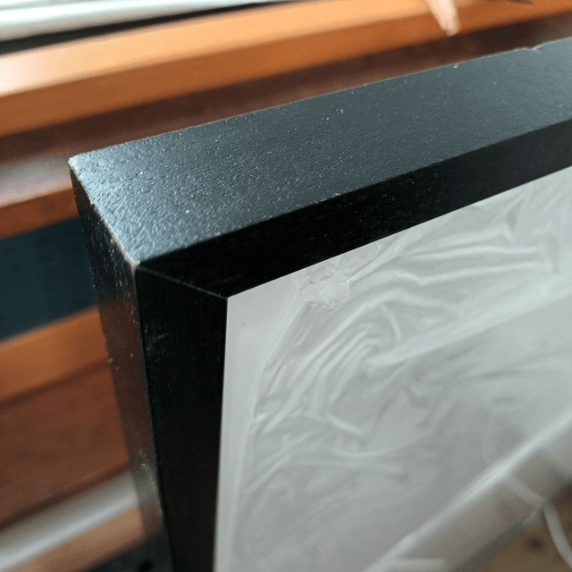 Wooden black painted frame with quality acrylic glass 70cmx100cm incl mount board.